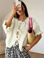 Elegant white round neck knit cardigan featuring stylish front bow-tie fasteners for women - S / Tops / White