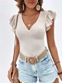 Close-up of a white V-neck ruffle sleeve knit top on a model with denim shorts. - S / Tops / Apricot