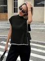 Stylish black sleeveless knit vest with white scalloped trim and elegant side bows. - S / Tops / Black