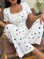 Close-up of white ribbed pajama set featuring colorful heart prints and lace trim - S / Top And Bottom / White Mixed Print