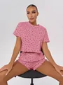 Comfortable pink pajama set for women featuring delicate red heart pattern and ruffled hems - S / Top And Bottom / Pink