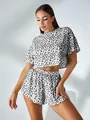 Detail view of women's leopard print two-piece loungewear set with crop top and shorts - S / Top And Bottom / Black