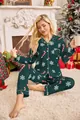 Detail view of a model in dark green Christmas pajamas with candy cane prints - S / Top And Bottom / Green