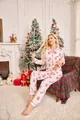 Detailed view of women's Christmas pajama set with red snowflake and candy cane prints - S / Top And Bottom / White