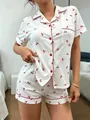 White cotton pajama set with red cherry print and piping detail on short sleeves and shorts - S / Top And Bottom / Cherry