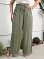 Detail shot of olive green wide-leg casual pants showing the elastic drawstring waist - 2XL / Bottoms / Light Green