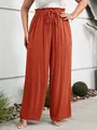 Detail of rust red high waist trousers with drawstring and large patch pockets - 2XL / Bottoms / Watermelon red