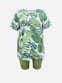 Front view of two-piece set featuring tropical leaf print top and olive green shorts. - 1XL / Top And Bottom / Green