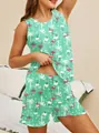 Close-up of green pajama set with pink flamingo and palm tree prints for women - S / Top And Bottom / Green Flamingo