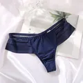 Close-up detail of navy blue low-waist ice silk thong with striped mesh side panels - M / Bottoms / Blue