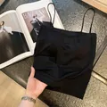 Minimalist seamless black camisole tank top with thin straps and wireless support - One Size / Long Style Top / Black