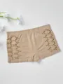 Nude seamless safety pants with geometric hollow-out design and hip-lifting effect. - Nude
