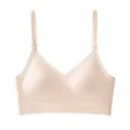 Front view detail of a seamless beige bra with adjustable straps on a white background. - 2XL / Tops / Light Skin