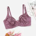 Detail view of purple plus size lace bra with underwire support and elegant floral props - Light Purple