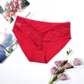 Detailed view of red floral lace panties with breathable fabric and cross-strap waist. - 0XL / Red