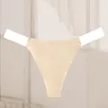 Close-up detail of seamless beige thong featuring invisible transparent waist straps. - Off White