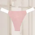 Close-up detail of a sexy pink seamless thong with transparent elastic side straps - Pink