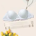 Detailed macro shot of white floral lace balconette bra with clear detachable straps - 32/70B / Tops / White