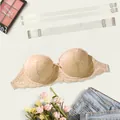 Detail of beige lace half-cup bra with clear straps and flat lay styling. - 32/70B / Tops / Beige