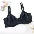 Close-up of thin full cup bra with elegant dark floral pattern and bow detail - 44E/100E / Tops / Black