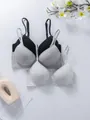 Close-up of comfortable cotton bras in black and grey marl featuring adjustable straps. - 70B / Tops / Black