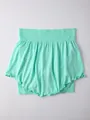 Close-up view of a mint green fake two-piece yoga skirt with ruffled hem and elastic waist - S / Bottoms / Light Green