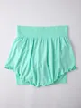 Close-up view of a mint green fake two-piece yoga skirt with ruffled hem and elastic waist - S / Bottoms / Light Green