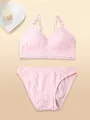 Detail of pink wireless lingerie set featuring adjustable straps and textured fabric - S / Top And Bottom / Pink