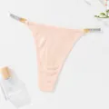 Sexy peach ribbed thong for women featuring sparkling rhinestone and metal strap details - Apricot
