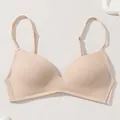 Detailed view of a seamless thin nude bra featuring adjustable straps and smooth fabric finish - 70B / Tops / Nude