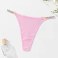 Sexy pink ribbed thong for women featuring decorative metal rings and rhinestone straps - S / Bottoms / Light Pink