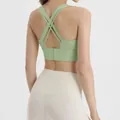 Back view of light green cross-strap sports bra with adjustable back hooks - S / Tops / Matcha Green
