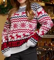 Detail shot of cozy Christmas knit sweater featuring reindeer and snowflake patterns. - S / Tops / White (Women)