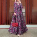 Full length view of a long-sleeved purple floral maxi dress styled with a red bag. - S / Top And Bottom / Purple