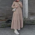 Detailed view of tiered brown and white gingham puff sleeve maxi dress for women's fashion - Camel