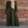 Loose plus size dark green maxi dress with belt on a model against a brick wall - S / Top And Bottom / Green