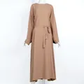 Front view of tan modest long-sleeved maxi dress with matching waist tie belt detail - Khaki
