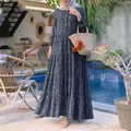 Elegant navy blue floral tiered maxi dress with button front detail in a poolside setting - S / Top And Bottom / Dark Blue