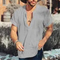 Detail view of men's casual grey cotton linen shirt with textured fabric and V-neckline - S / Tops / Gray