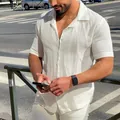 Close-up of white textured short-sleeve shirt on a male model in a sunny city street - XL / Tops / White