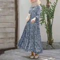 Detail view of a blue floral tiered maxi dress with loose pullover design and round neck - S / Top And Bottom / Light Blue