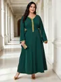 Close-up detail of elegant dark green plus size maxi dress with golden V-neck trim and waist tie - 0XL / Top And Bottom / Green