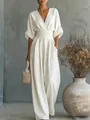 Elegant white V-neck jumpsuit with a cinched waist and wide-leg design for summer. - S / Top And Bottom / White