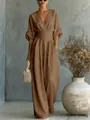 Elegant brown V-neck cinched waist wide-leg jumpsuit worn by a model in an airy room - Dark Brown