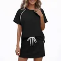 Athletic two-piece set for women featuring a black short sleeve top and side stripe skirt - S / Top And Bottom / Black