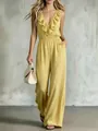 Elegante gele mouwloze jumpsuit met V-hals, ruches en wijde pijpen voor dames - S / Top And Bottom / Geel