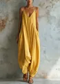 Detailed view of yellow deep V neck jumpsuit with loose harem pant silhouette - S / Top And Bottom / Yellow