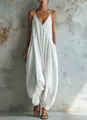 Detail of white spaghetti strap jumpsuit with deep V-neck and loose harem pants - S / Top And Bottom / White