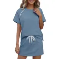 Detalle de conjunto deportivo de dos piezas para mujer con rayas laterales - Aguamarina