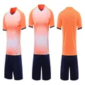 Front and back views of a sublimation-printed soccer uniform set with orange gradient - 4XS / Top And Bottom / Fluorescent Orange